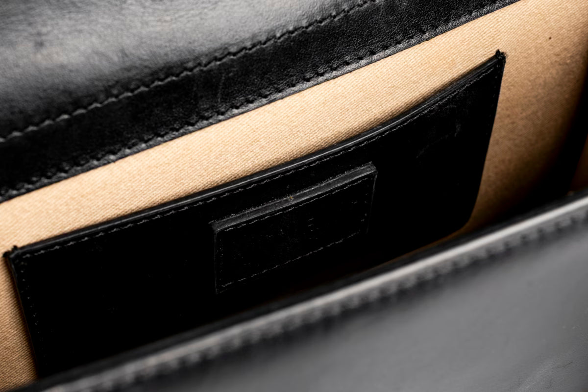 The large Bambino Handbag with adjustable crossbody strap